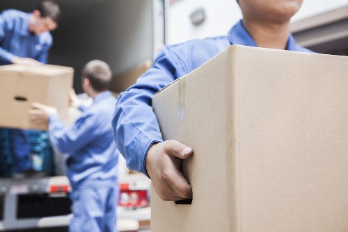 Moving team protecting belongings during a Maidavale van relocation
