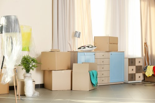 Trained movers loading furniture safely with care