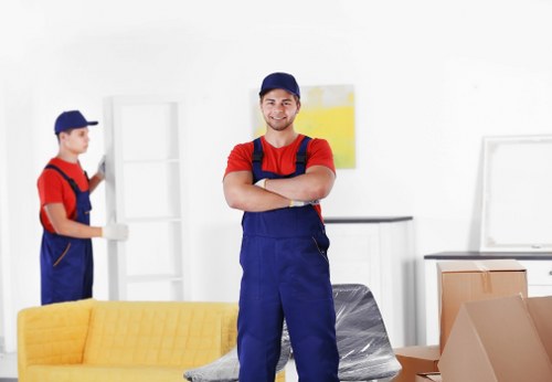 Movers handling a residential move in Maida Vale street setting