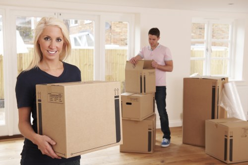 Local moving team preparing furniture for transport in Maida Vale