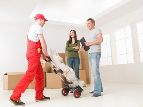 Careful loading of household items by a removals crew in Maida Vale